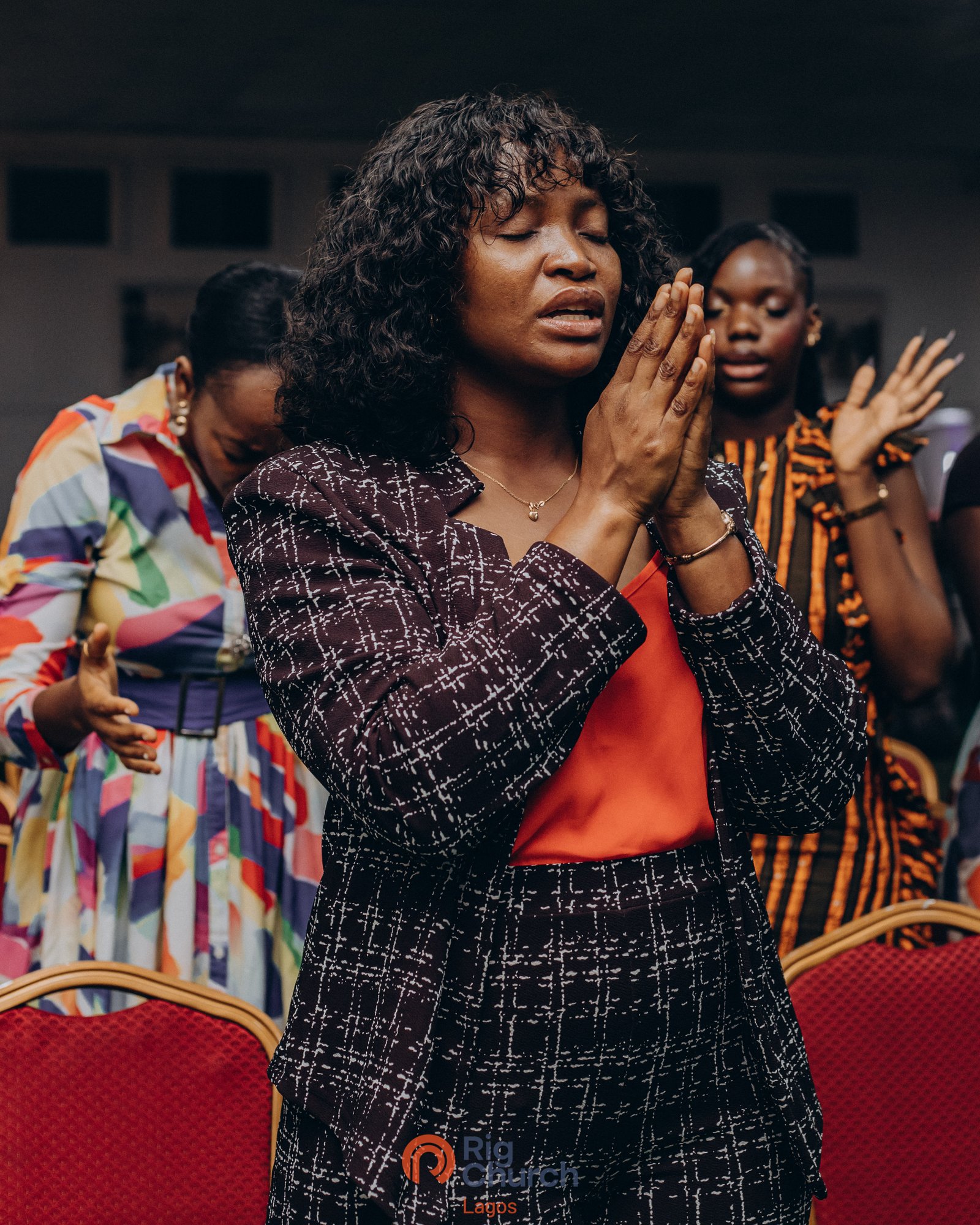 A young girl at Rig Church Lagos holding a welcome sign